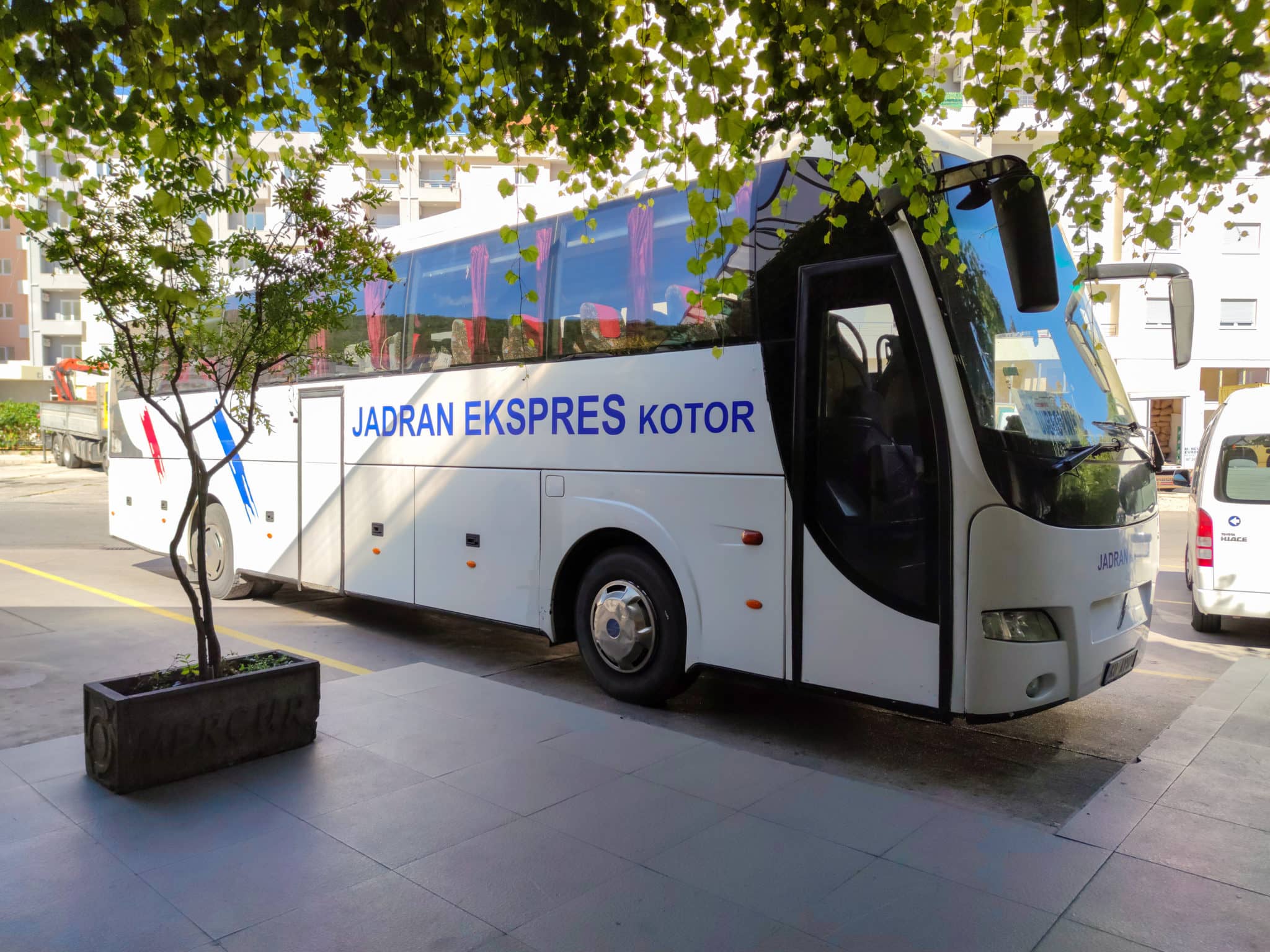 A Jadran Ekspres Kotor bus at the Budva bus station in Montenegro