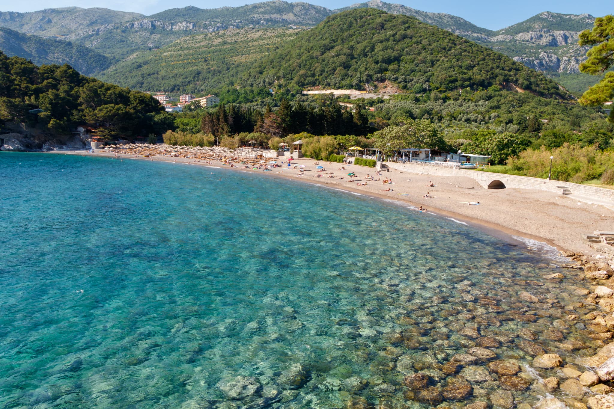 Lucice beach in the bay near Petrovac, on the Budva Riviera. Montenegro. The Adriatic Sea. Beautiful nature, mountains, forests, clear water.