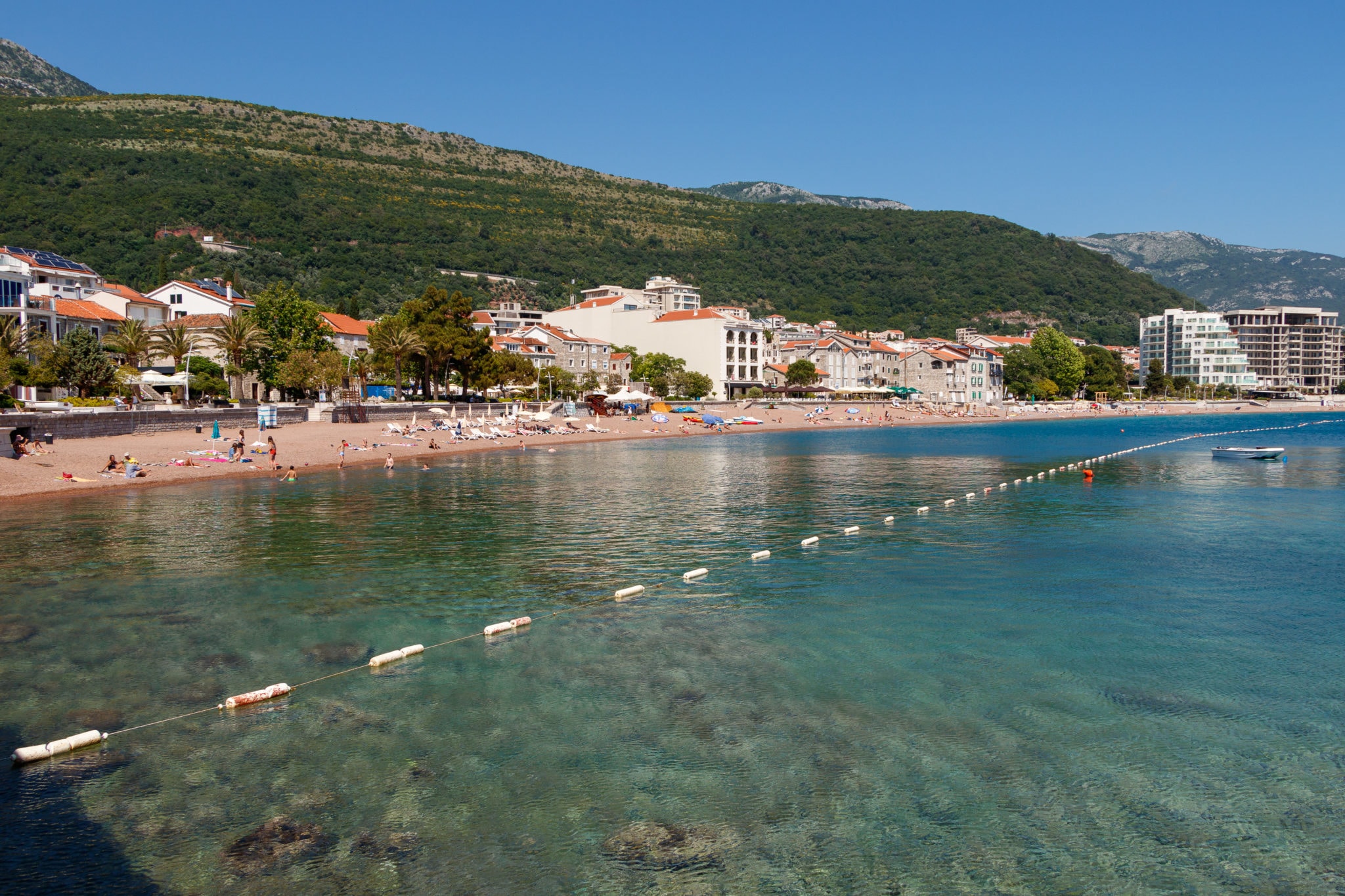 Petrovac city beach on the Budvanian Riviera in Montenegro. The Adriatic Sea, mountains.