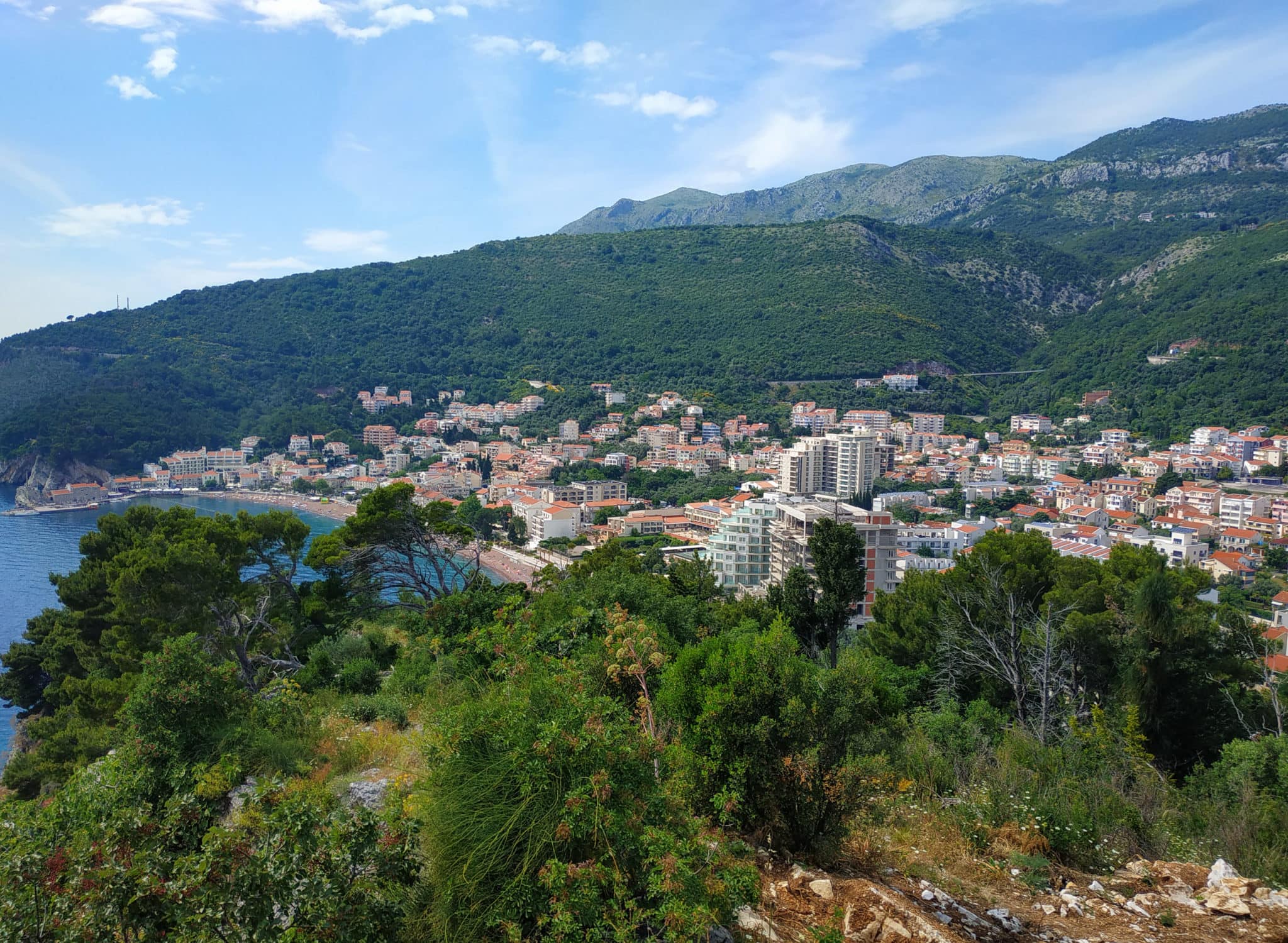 Town of Petrovac in Montenegro. Budva Riviera. New hotels against the backdrop of the old city.