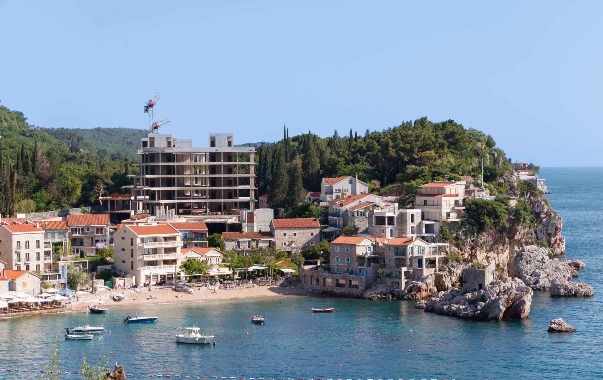 The village of Przno on the Budva Riviera in Montenegro. An ugly building in the background.