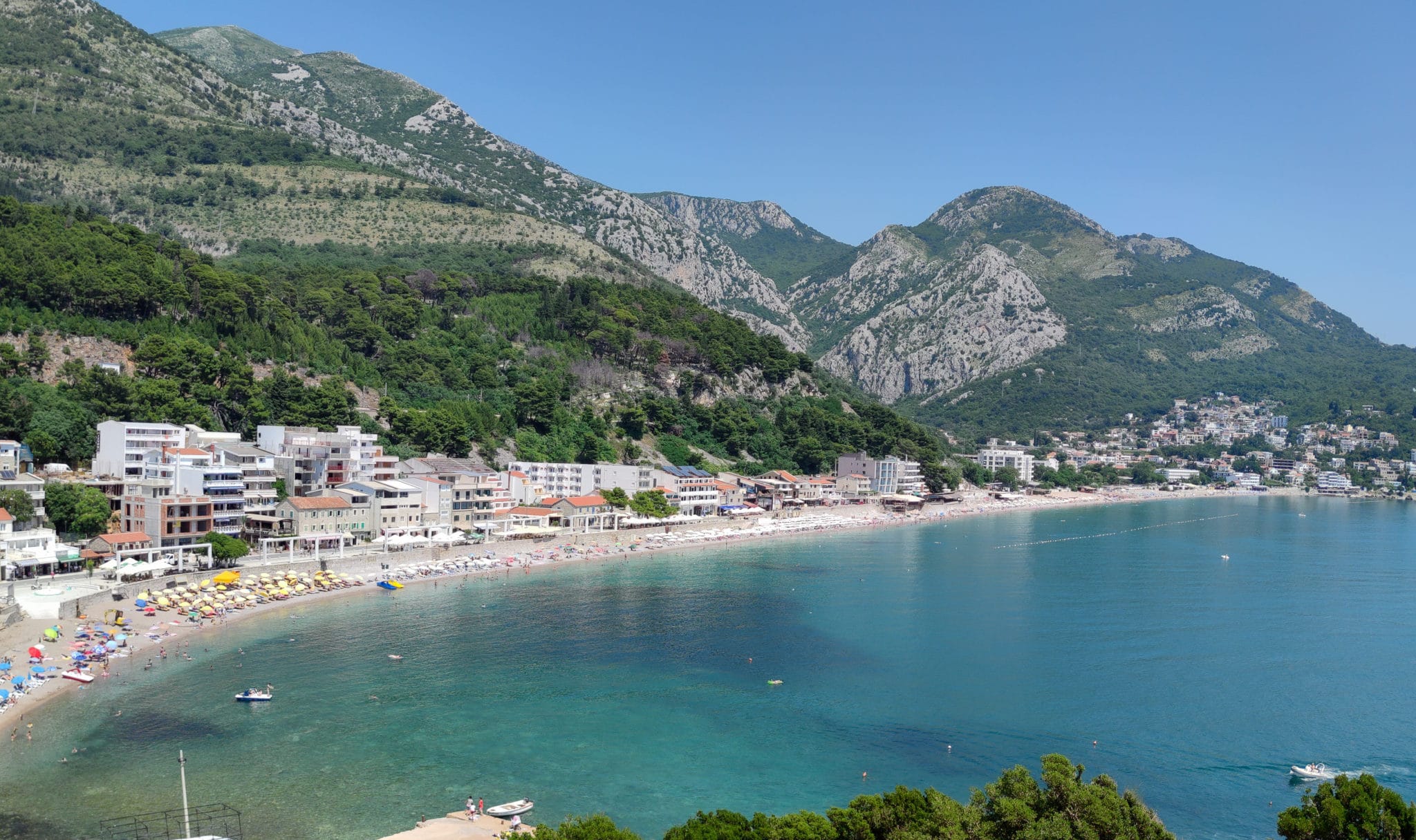 Panorama of the beach in the town of Sutomore on the Bar Riviera in Montenegro. The Adriatic Sea. The mountains.