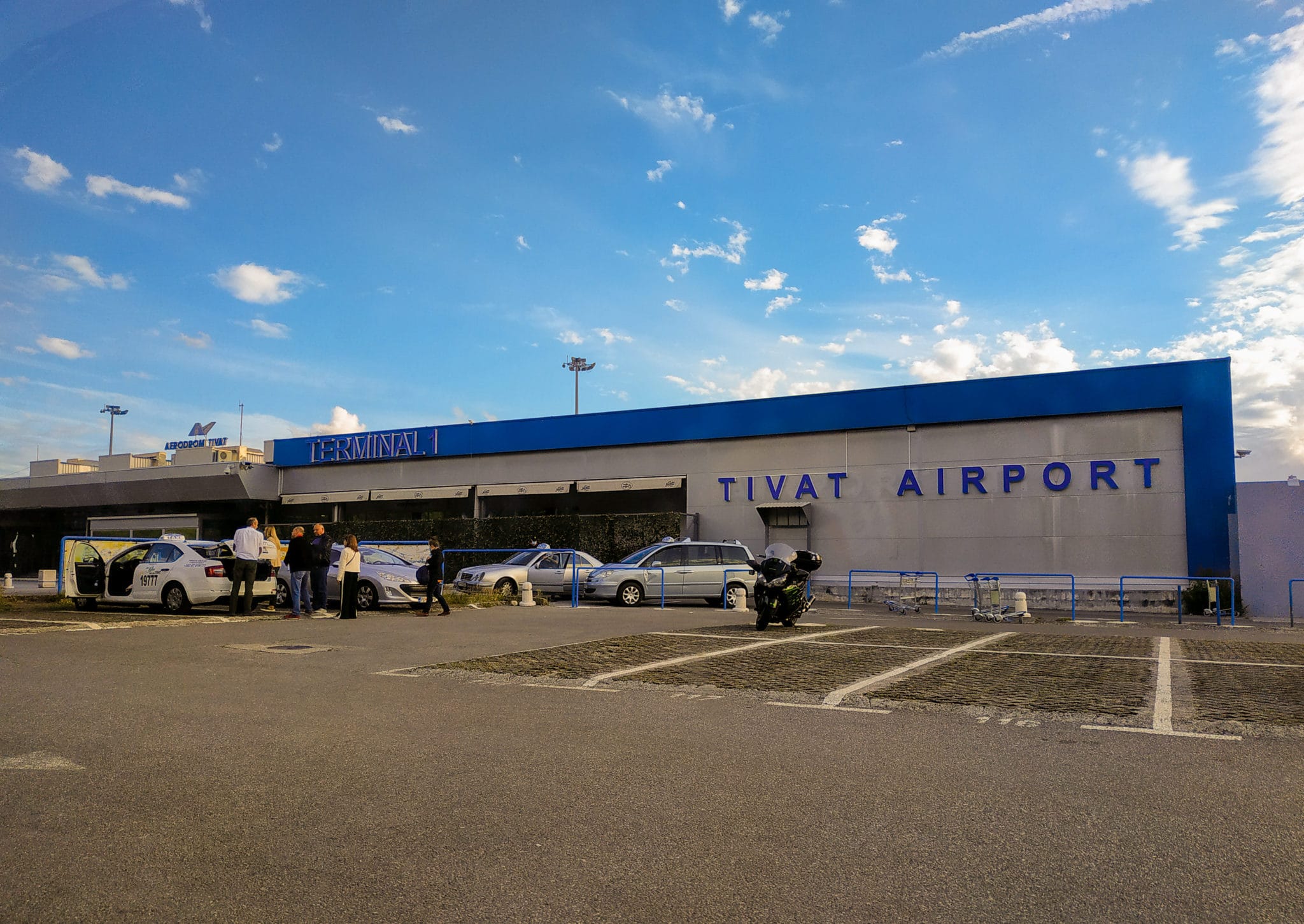 Tivat airport - passenger terminal. Taxi drivers are waiting for passengers.