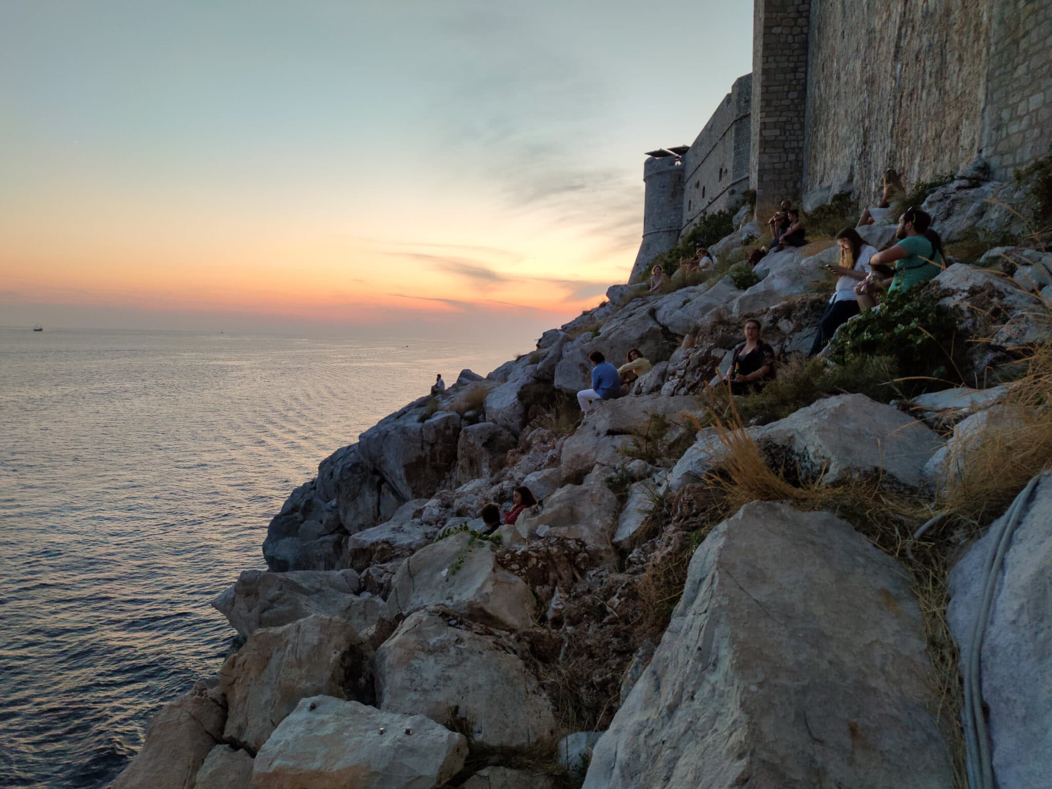 Dubrovnik, Croatia. Evening. Sunset meeting point on a cliff outside the city walls.