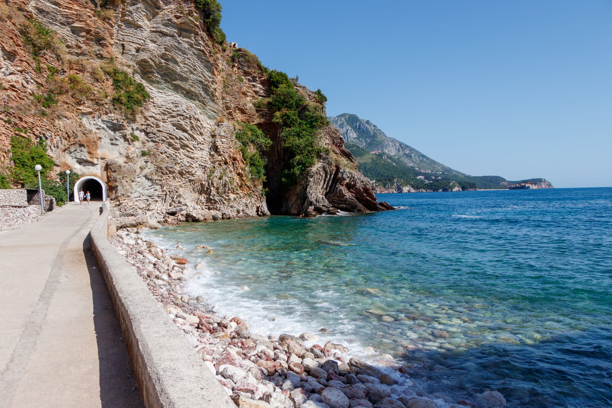 Entrance to the tunnel to Kamenevo beach. Budvavanian Riviera. Montenegro. May 2021.