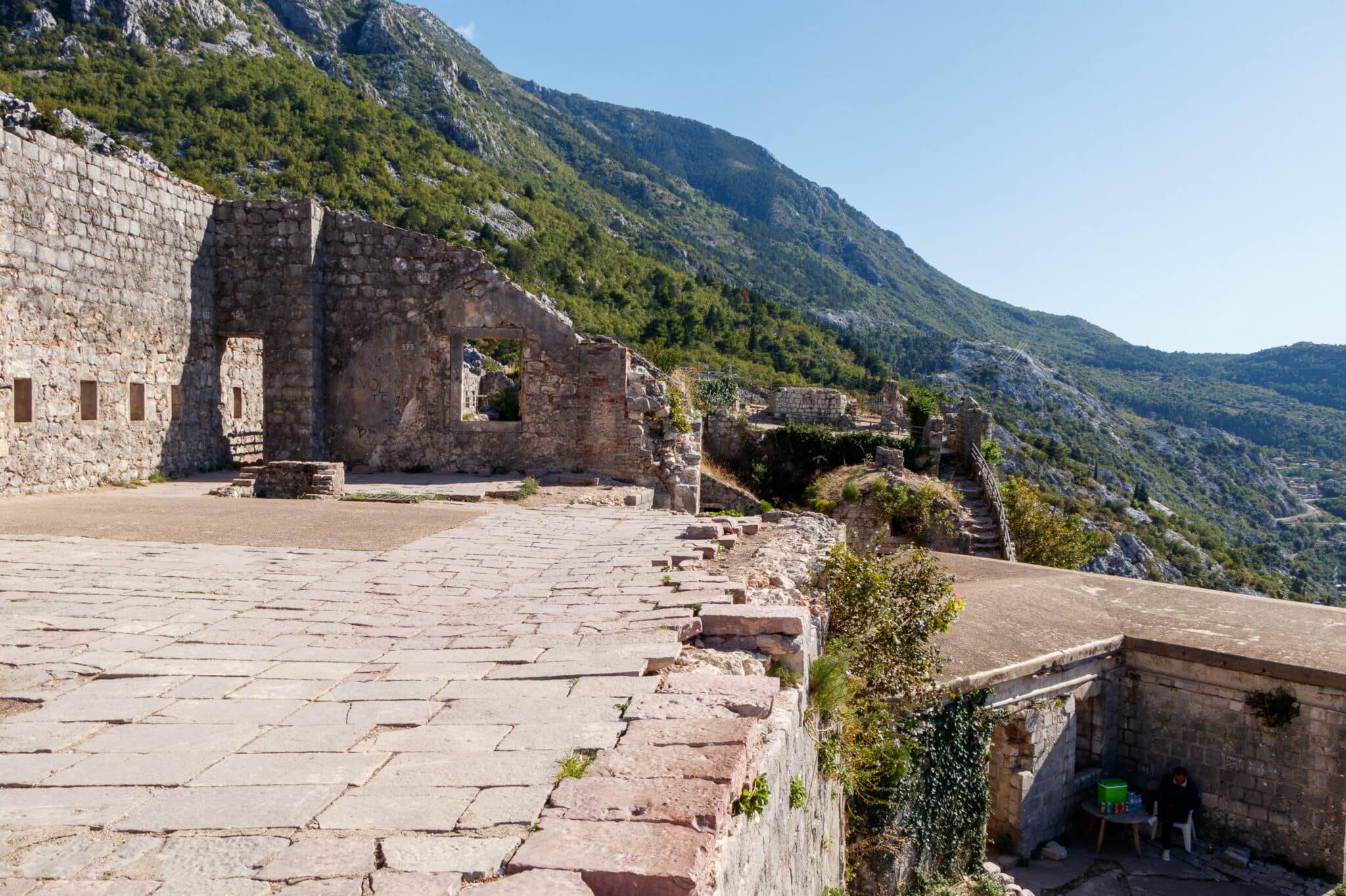 Montenegrin sells cold drinks from a thermal bag in the St. John's Fortress in Kotor, Montenegro.