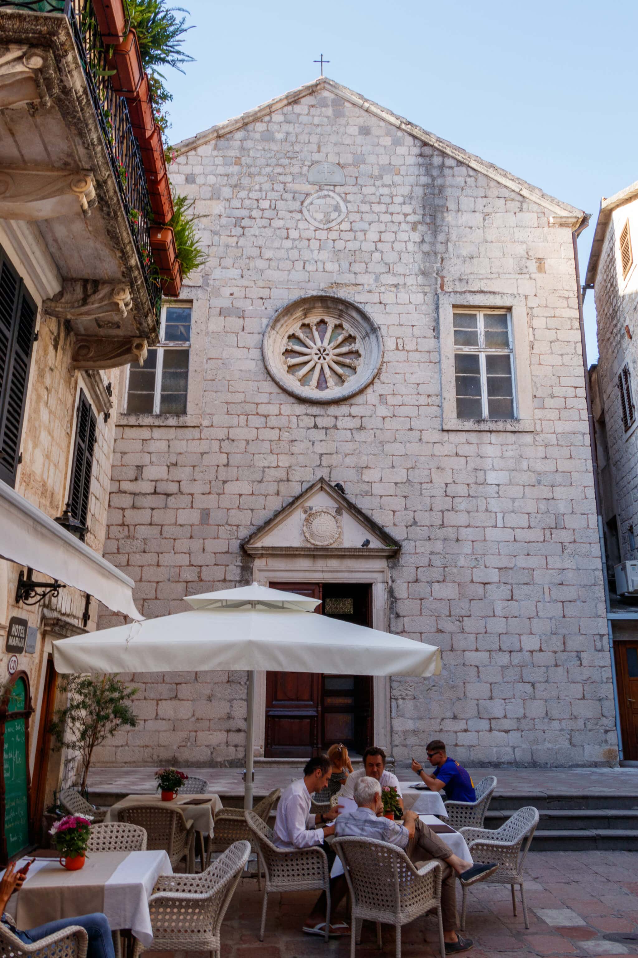 A restaurant near the church's entrance in the Kotor Old Town in Montenegro